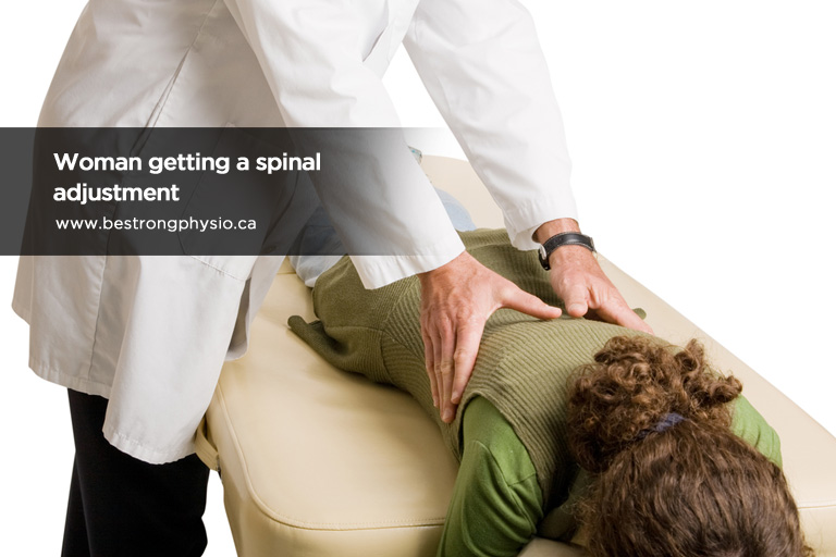 Woman getting a spinal adjustment